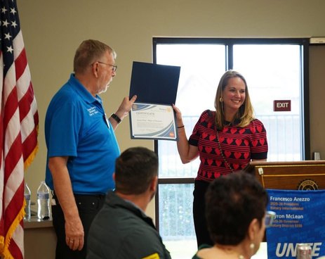 Beaumont Mayor Jessica Voigt receiving a certificate from President Doug Emery
