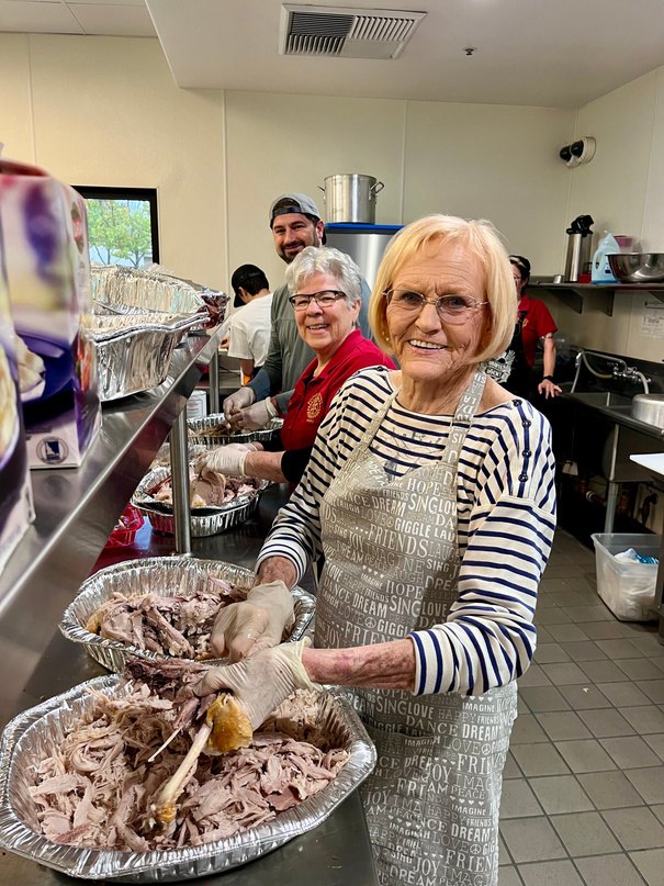 Marsha Becker volunteering in the Thanksgiving dinner kitchen